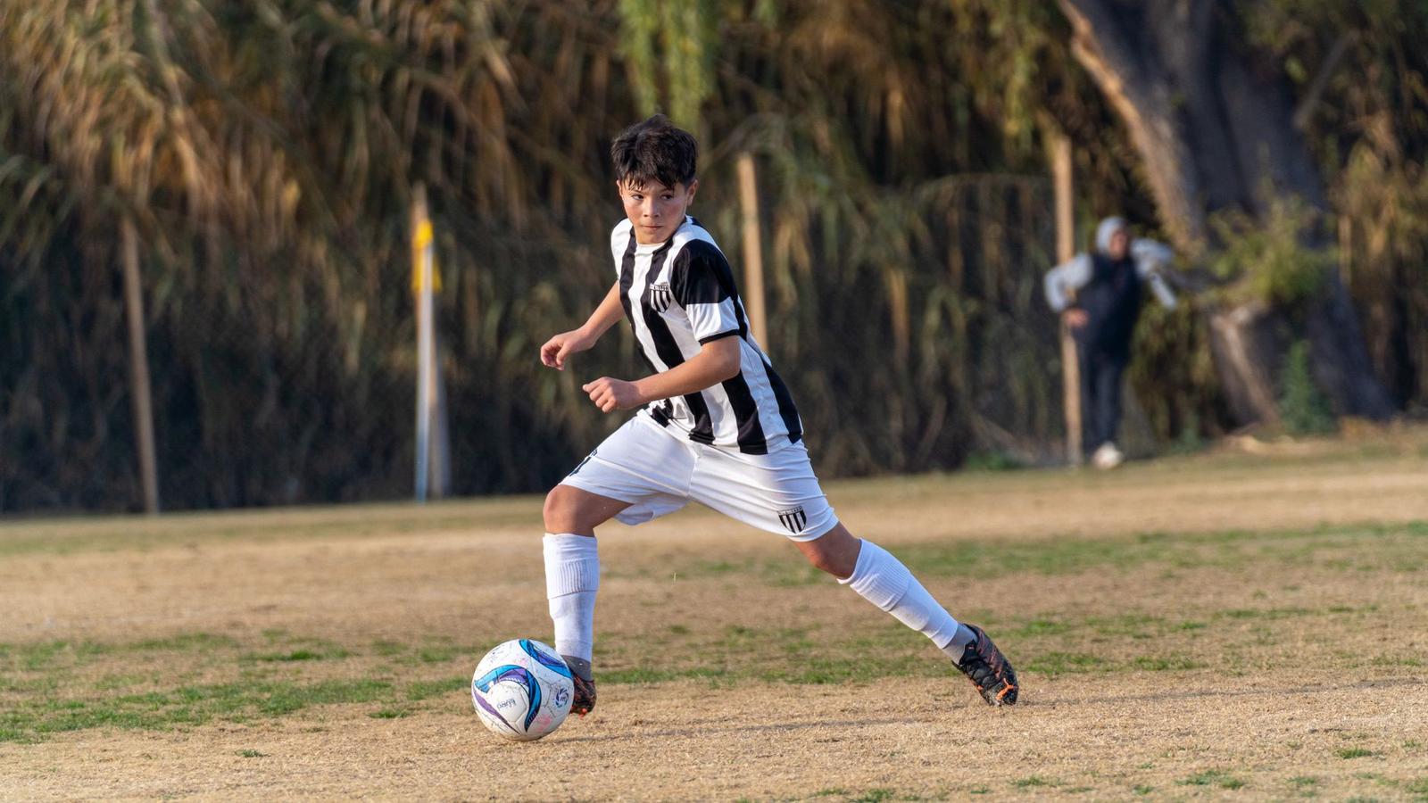 Junior Soccer Player in Action on Field